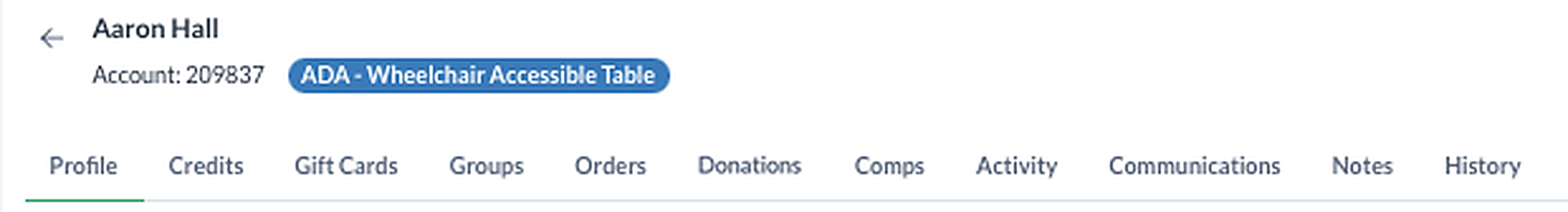 The top of a patron record in TixPro 8: the patron's name, account number and accessibility flag, and the tabs for credits, gift cards, groups, orders, donations, comps, activity, communications, notes and history